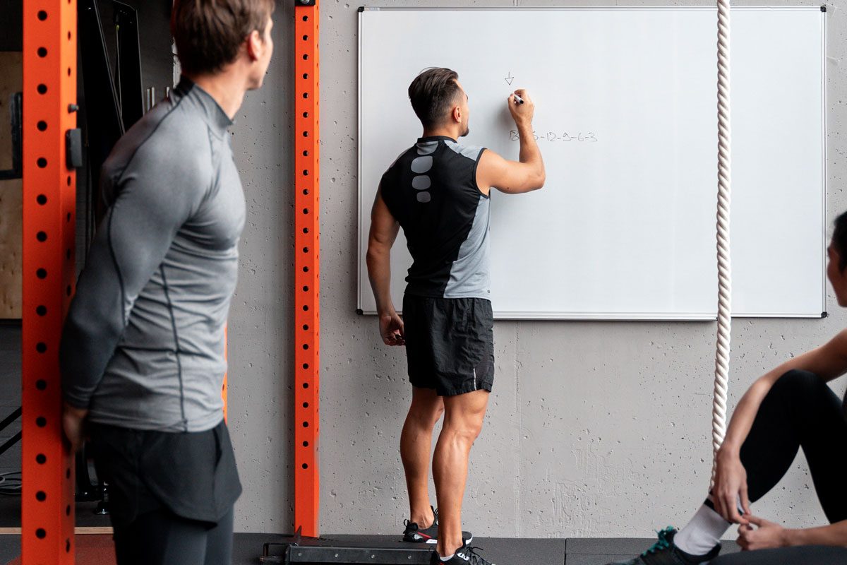 man workwing out with dumbbells gym